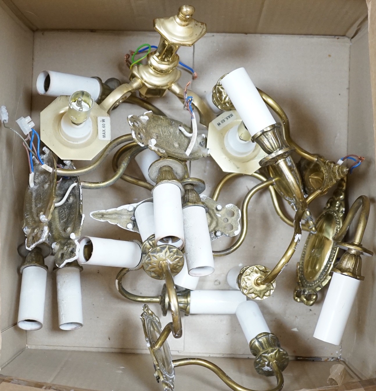 A set of seven brass two branch wall lights and one similar